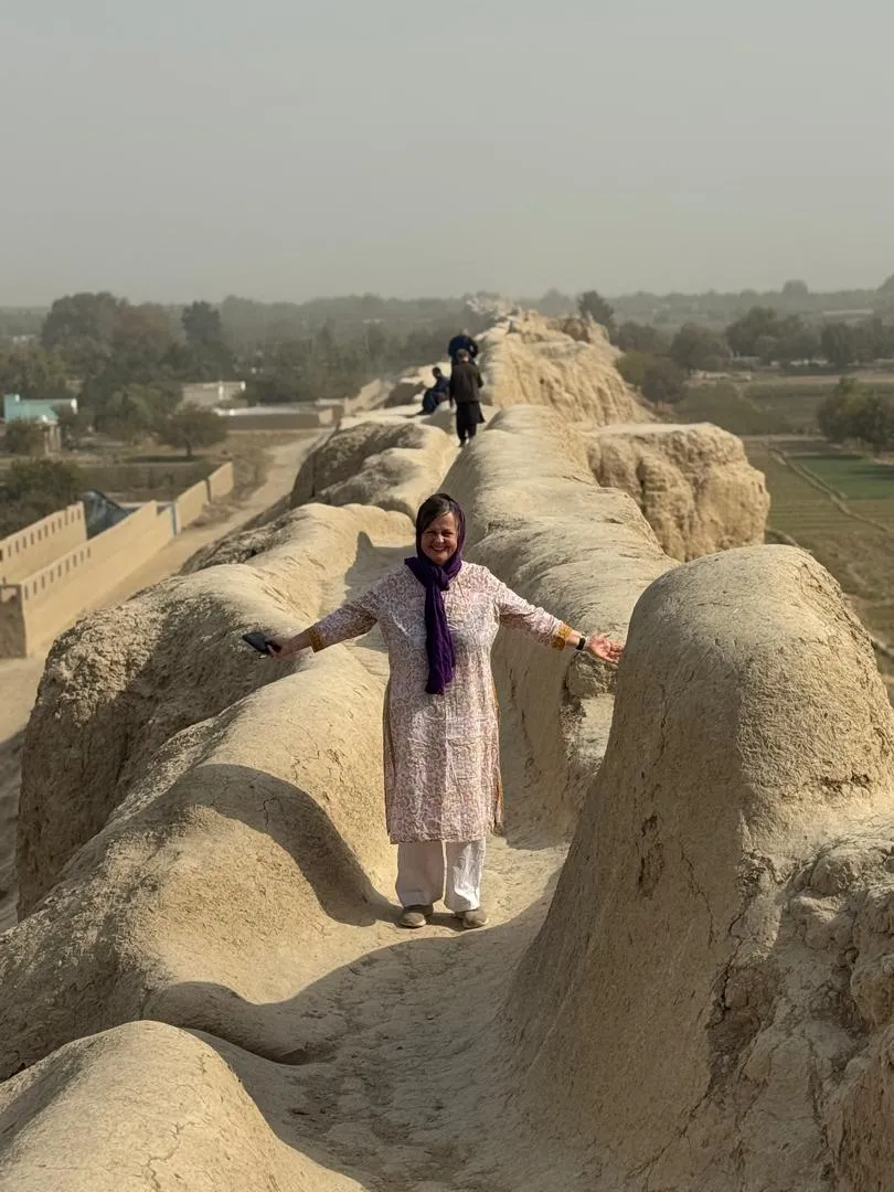 One of our traveler group members on the ancient walls of Balkh.